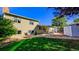 Backyard view showcasing home's exterior and patio area at 2519 S Sable Way, Aurora, CO 80014