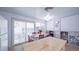 Bright dining area with built-in shelving and sliding glass doors to backyard at 2519 S Sable Way, Aurora, CO 80014