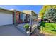 Front porch with metal railing and potted plants at 2519 S Sable Way, Aurora, CO 80014