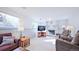 Gathering room with fireplace, two brown recliners, and a large flat-screen TV at 2519 S Sable Way, Aurora, CO 80014