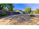 Side yard with gravel landscaping and wooden fence at 2519 S Sable Way, Aurora, CO 80014