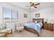 Cozy bedroom features a comfortable bed, soft natural light, and neutral decor at 2010 E 125Th Pl, Thornton, CO 80241