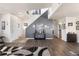 Inviting foyer with modern decor, hardwood floors, and a staircase leading to the upper level at 2010 E 125Th Pl, Thornton, CO 80241