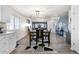 Open-concept kitchen flowing into the dining and living areas, perfect for gatherings at 2010 E 125Th Pl, Thornton, CO 80241