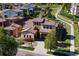 Beautiful aerial view of a two-story home in a lush community with manicured lawns and walking paths at 15179 W Washburn Ave, Lakewood, CO 80228
