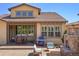 Inviting backyard patio with outdoor kitchen, fire pit, and dining area, perfect for entertaining guests at 15179 W Washburn Ave, Lakewood, CO 80228