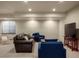 Spacious basement with recessed lighting, furniture, and large television at 15179 W Washburn Ave, Lakewood, CO 80228