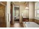 Spacious bathroom features walk-in closet, soaking tub, and a walk-in shower at 15179 W Washburn Ave, Lakewood, CO 80228