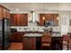 A kitchen with stainless steel appliances, granite counters and pendant lighting at 15179 W Washburn Ave, Lakewood, CO 80228