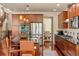 Spacious kitchen has stainless appliances, granite counters, and a center island at 15179 W Washburn Ave, Lakewood, CO 80228