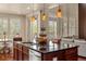 This kitchen features a large island, modern lighting, and stainless steel appliances at 15179 W Washburn Ave, Lakewood, CO 80228