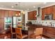 Gourmet kitchen boasts stainless steel appliances, a center island and seating at 15179 W Washburn Ave, Lakewood, CO 80228
