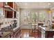 This kitchen offers stainless steel appliances, custom backsplash and an open layout at 15179 W Washburn Ave, Lakewood, CO 80228