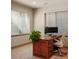 Bright home office filled with natural light features a modern desk setup, perfect for working or studying at 15179 W Washburn Ave, Lakewood, CO 80228