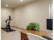 Well-lit home office with exercise bike, perfect for working from home while staying active at 15179 W Washburn Ave, Lakewood, CO 80228