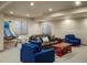 Spacious basement recreation room perfect for entertaining, featuring comfortable seating and ample play space at 15179 W Washburn Ave, Lakewood, CO 80228