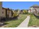 Picturesque street view showcasing well-maintained homes and lush green spaces at 15179 W Washburn Ave, Lakewood, CO 80228