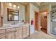 Rustic bathroom featuring a wood vanity, a tile countertop, and a glass-enclosed shower at 2094 Lost Canyon Ranch Ct, Castle Rock, CO 80104