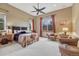 Cozy bedroom with a large bed, seating area, and windows providing natural light at 2094 Lost Canyon Ranch Ct, Castle Rock, CO 80104