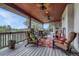 Spacious deck with seating area, ceiling fans, and beautiful views of the surrounding landscape at 2094 Lost Canyon Ranch Ct, Castle Rock, CO 80104