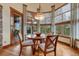 Dining area featuring large windows, hardwood floors, and a stylish light fixture at 2094 Lost Canyon Ranch Ct, Castle Rock, CO 80104
