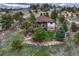 Exterior of home surrounded by trees and hillside showcasing the outdoor living space at 2094 Lost Canyon Ranch Ct, Castle Rock, CO 80104
