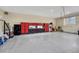 Organized garage with ample storage cabinets and epoxy flooring for easy maintenance at 2094 Lost Canyon Ranch Ct, Castle Rock, CO 80104
