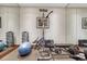 Home gym with workout equipment, mirrored walls, and rubber flooring for safety and comfort at 2094 Lost Canyon Ranch Ct, Castle Rock, CO 80104