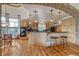 Kitchen featuring custom wood cabinets, granite countertops and bar seating at 2094 Lost Canyon Ranch Ct, Castle Rock, CO 80104