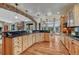 Kitchen featuring custom wood cabinets, granite countertops and an open concept layout at 2094 Lost Canyon Ranch Ct, Castle Rock, CO 80104