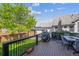 Back deck featuring outdoor dining space with a covered gazebo and well maintained backyard at 11093 Nome St, Commerce City, CO 80640