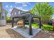 Inviting backyard patio with gazebo, lounge seating and rock landscaping, perfect for outdoor relaxation at 11093 Nome St, Commerce City, CO 80640