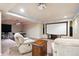 Finished basement featuring a projector screen, pool table and comfortable seating at 11093 Nome St, Commerce City, CO 80640