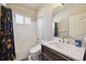 Stylish bathroom features modern fixtures and a luxurious shower-tub combination at 11093 Nome St, Commerce City, CO 80640