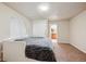 Bright carpeted bedroom with neutral walls, closet and ensuite bathroom at 11093 Nome St, Commerce City, CO 80640