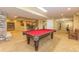 Expansive basement with a billiards table, staircase, and potential living space at 6761 Mary Ct, Castle Pines, CO 80108