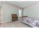 Bedroom with light green walls, flower wallpaper border and a bed at 6761 Mary Ct, Castle Pines, CO 80108
