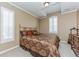 Bedroom with a gold headboard and a light beige color scheme at 6761 Mary Ct, Castle Pines, CO 80108