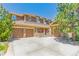 Charming home featuring a three-car garage and beautiful stone accents enhancing the exterior's curb appeal at 6761 Mary Ct, Castle Pines, CO 80108