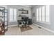 Bright home office featuring two windows with shelves and gray walls at 6761 Mary Ct, Castle Pines, CO 80108