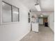 Spacious unfinished basement area with laundry, window and access to exterior door at 770 Havana St, Aurora, CO 80010