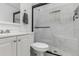 Modern bathroom featuring a sleek glass-enclosed shower and stylish white vanity at 770 Havana St, Aurora, CO 80010