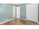 Bedroom with hard wood floors, blue walls, and white trim at 770 Havana St, Aurora, CO 80010