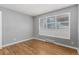 Bedroom with hardwood floors and natural light from a large window, creating a serene space at 770 Havana St, Aurora, CO 80010