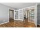 Hardwood floors in living room with open doorway to dining area, showcasing a spacious layout at 770 Havana St, Aurora, CO 80010