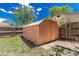 Outdoor shed with lawn beside a wooden fence and grassy area at 770 Havana St, Aurora, CO 80010