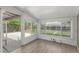 Enclosed sunroom with lots of natural light provided by large windows and access to backyard at 770 Havana St, Aurora, CO 80010
