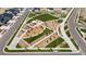 An aerial view of a community park complete with playground, green space and walking paths at 3453 N Gold Bug Ct, Aurora, CO 80019
