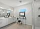 Modern bathroom featuring double sinks, a glass shower enclosure, and stylish decor creating a spa-like ambiance at 3453 N Gold Bug Ct, Aurora, CO 80019