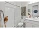 Bright bathroom featuring a glass shower, sleek vanity, and contemporary decor at 3453 N Gold Bug Ct, Aurora, CO 80019
